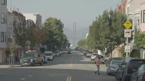 San Francisco, CA - Dec 15, 2024: Street with bridge tower in background Видео 333580814