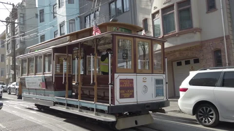 San Francisco Cable Car Pulling Away with Waymo Car Following Behind Stock Footage 307223241