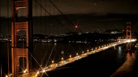 San Francisco Golden Gate Bridge at night with a star filter lens efx Stock Footage
