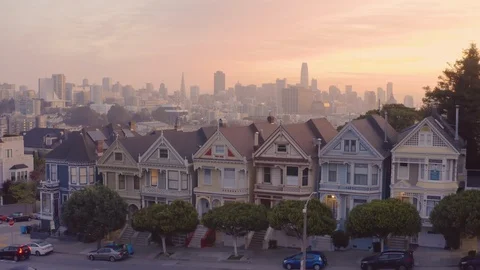 San Francisco Painted Ladies houses aerial morning sunrise flyover drone Stock Footage