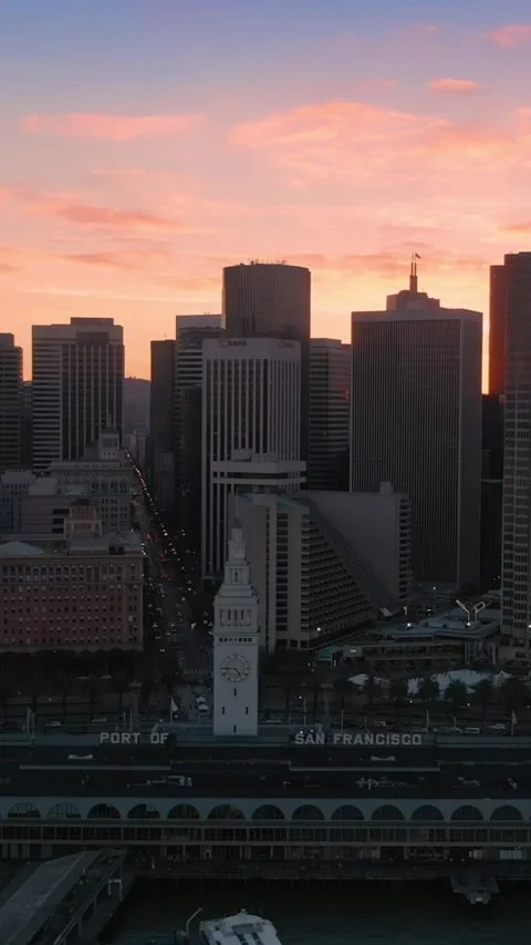 San Francisco skyline at sunset, featuring the Ferry Building.  USA Stock Footage 313603543