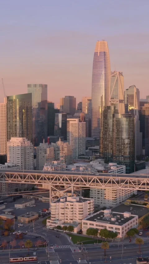San Francisco skyline at sunset, featuring skyscrapers and highways. USA Stock Footage 313779345