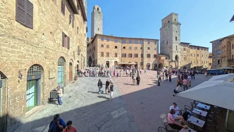 San Gimignano Piazza della Cisterna – High Stick Entrance &amp; Gelateria Queue Stock Footage 335169219