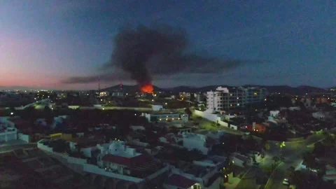 SAN JOSE DEL CABO BCS MEXICO-2023:A City At Night With A Fire In The Sky Stock Footage 245853662