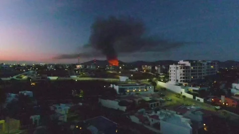 SAN JOSE DEL CABO BCS MEXICO-2023: A View Of A City At Night With A Fire In The Stock Footage 245853679