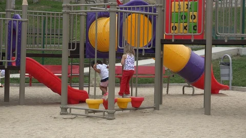 SAN JOSE DEL CABO MEXICO-2019: Young Children Playing In The Playground Outside Stock Footage 129304537