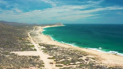 SAN JOSE DEL CABO MEXICO-2020: Rocky Coastline With Mountains In The Distance Stock Footage 142531738