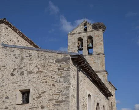San Pedro church bell tower with a stork nest in Montejo de la Sierra, Madrid Stock Photos
