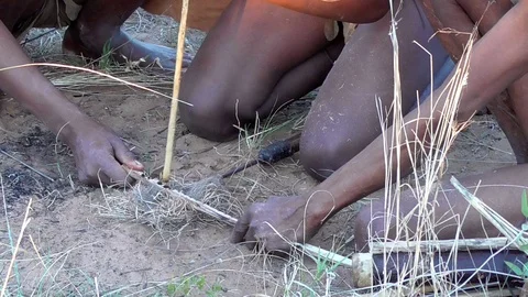 San people lighting a fire Stock Footage 96292383