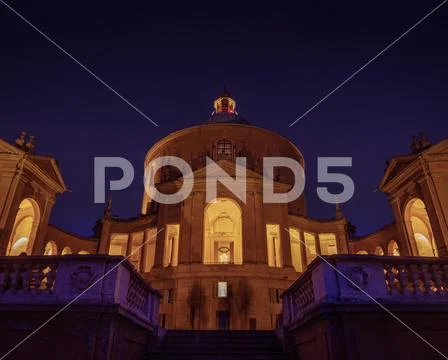 Sanctuary of the Madonna di San Luca at night in purple lights Stock Photos