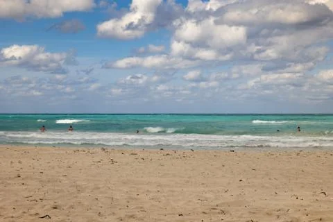 Sand and dramatic cloud sky at Caribbean sea Stock Photos