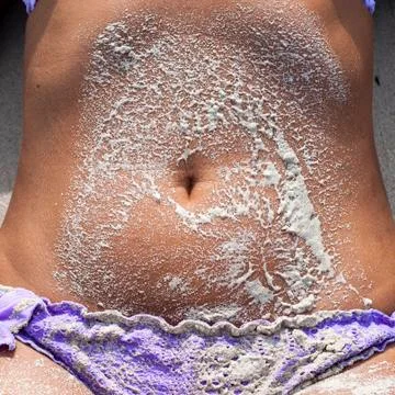 The sand and the navel Stock Photos