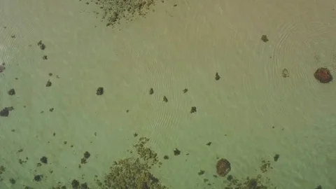 Sand and pepples seen through low water Stock Footage 92943524