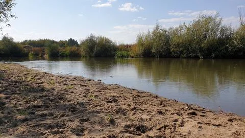 Sand and river. Stock Photos