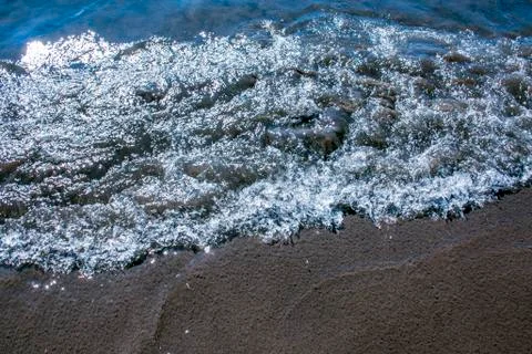 Sand and wave background Stock Photos