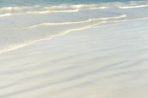 Sand and wave background Stock Photos
