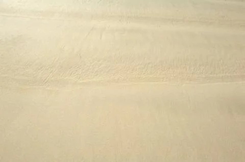 Sand and wave background Stock Photos
