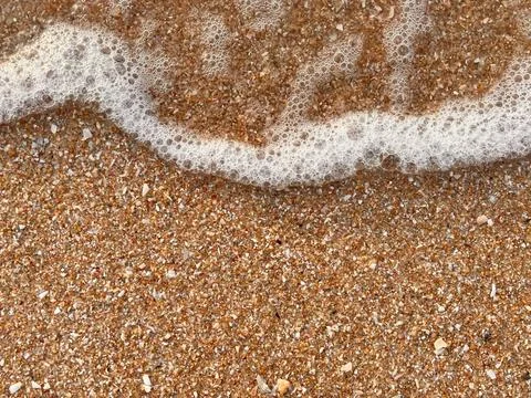 Sand and wave background Stock Photos