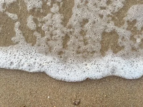 Sand and wave background Stock Photos