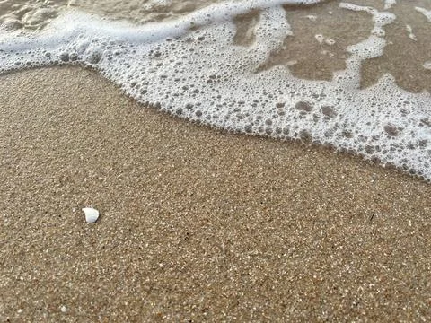 Sand and wave background Stock Photos