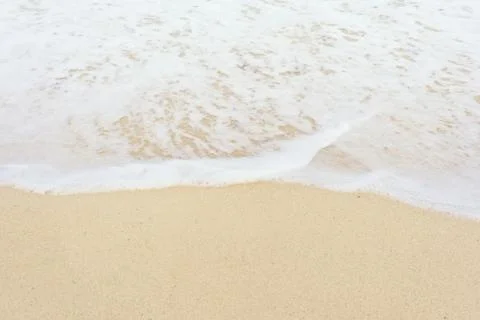 Sand and wave Stock Photos