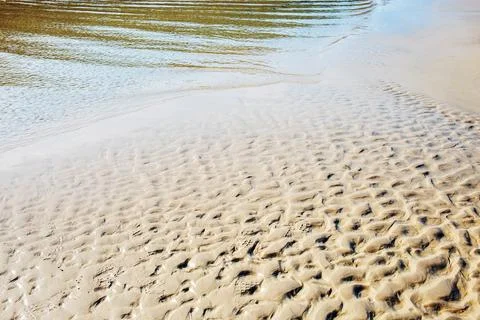 Sand and waves with background. Stock Photos