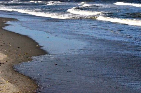 Sand and waves 写真素材