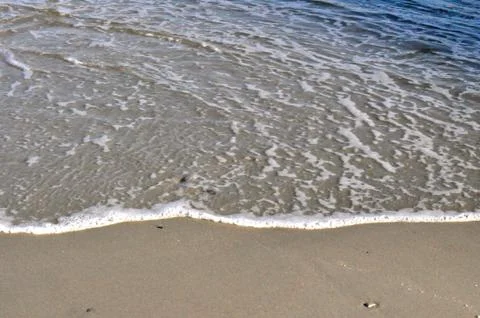 Sand and waves Fotos Stock