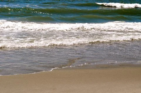 Sand and waves 写真素材