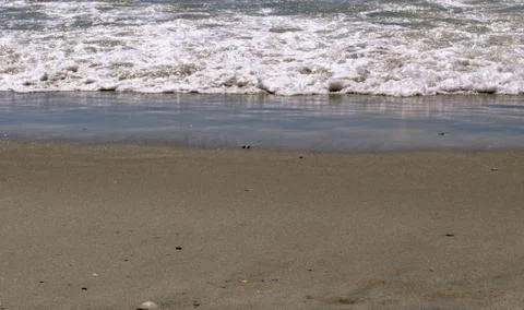 Sand and waves 스톡 사진