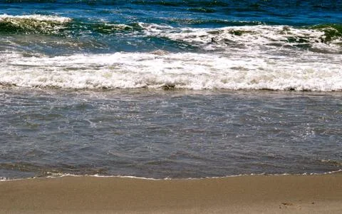 Sand and waves 写真素材