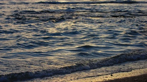 Sand And Waves On Sunset Beach. slow motion. Stock Footage 101466877