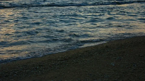 Sand And Waves On Sunset Beach. slow motion. Stock Footage 101470242
