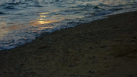 Sand And Waves On Sunset Beach. slow motion. Stock Footage 101472233