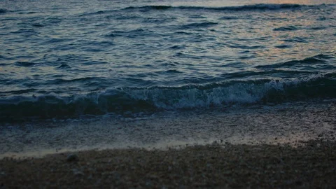 Sand And Waves On Sunset Beach. slow motion. Stock Footage 101473528