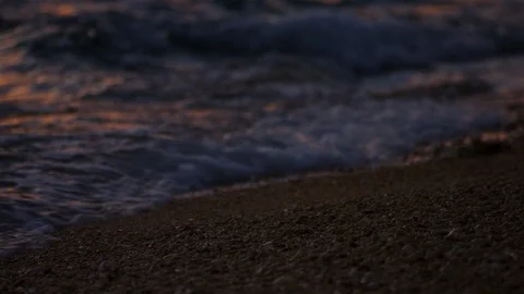 Sand And Waves On Sunset Beach. slow motion. Stock Footage 101477070