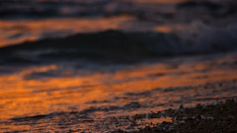 Sand And Waves On Sunset Beach. slow motion. Stock Footage 101477693