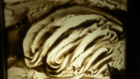Sand animation. Hand drawing in the sand on the light box. A woman writes var Stock Footage 157356757
