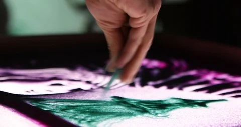 Sand animation performance with projection on the wall Stock-Footage 121620871