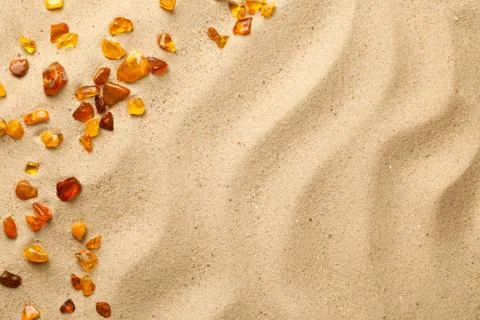 Sand Background With Scattered Ambers Stock Photos