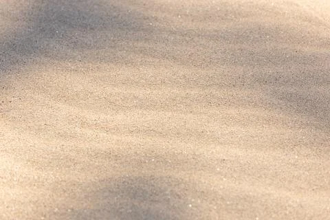 Sand background texture. Wave pattern Sandy beach backdrop Stock Photos