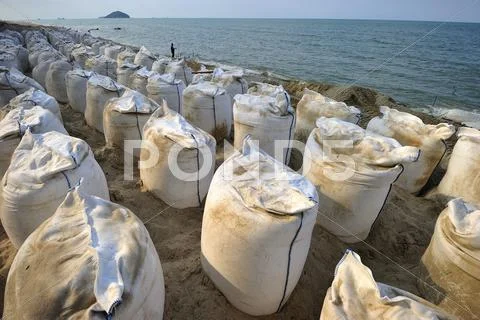 Sand Bags Along The Beach In Songkra To Protect From Heavy Surf And Erosion,