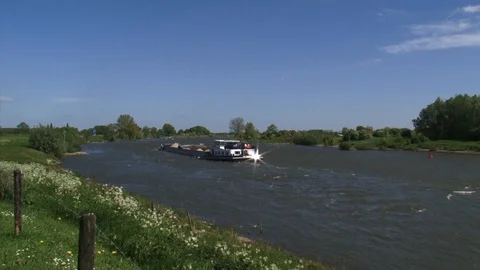 Sand barge sailing downstream the river IJssel, The Netherlands Stock Footage 107356787