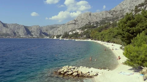 Sand Beach And Distant Rocks On Adriatic Coast in Croatia Stock Footage 98771944