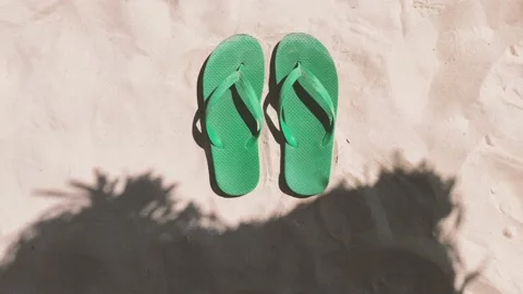 Sand beach and flip flops in summer. Vacations concept Stock-Footage 169881858