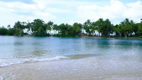 Sand beach and soft wave with blue water Stock Footage 106274042