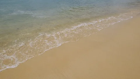 Sand beach and soft wave with blue water Stock Footage 106274140