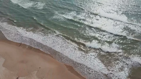 Sand beach and top view of sea waves, sunny weather Stock Footage 124785661
