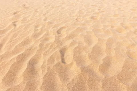 Sand beach background and texture pattern with space. Stock Photos