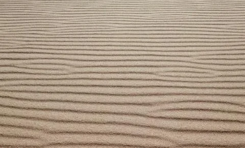 Sand on the beach as a background or texture Stock Photos